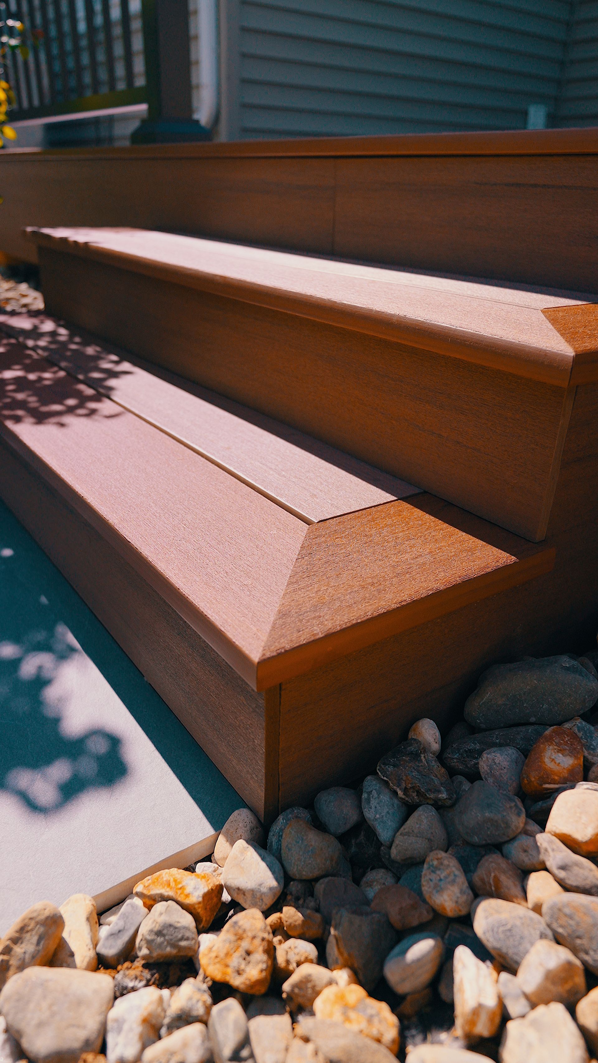A close up of a set of stairs next to a pile of rocks.