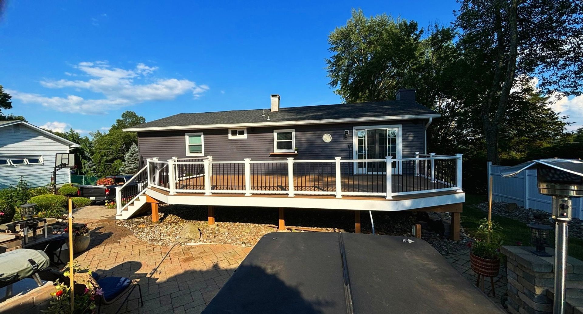 A house with a large deck on the side of it
