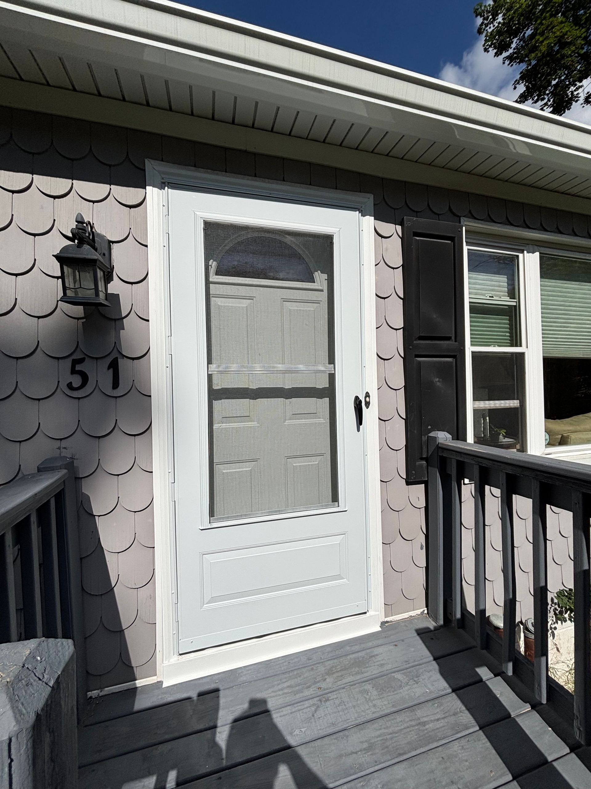 The front door of a house with the number 51 on it