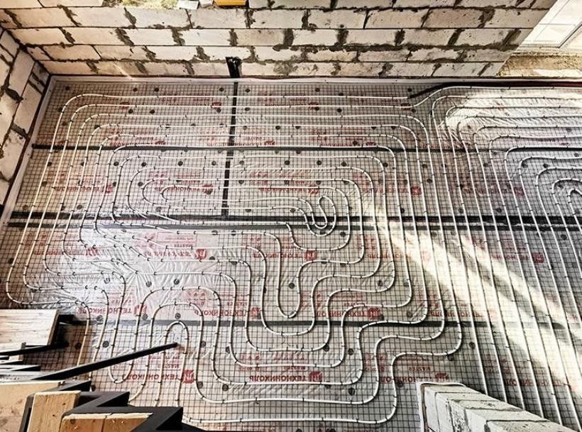Underfloor heating tubing exposed