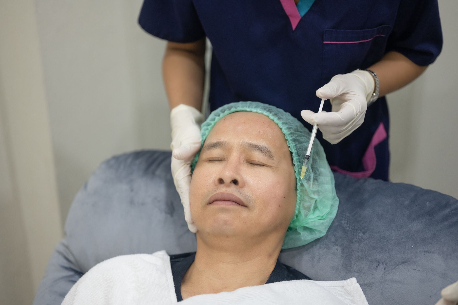 Botox injection of the eye to reduce wrinkles.