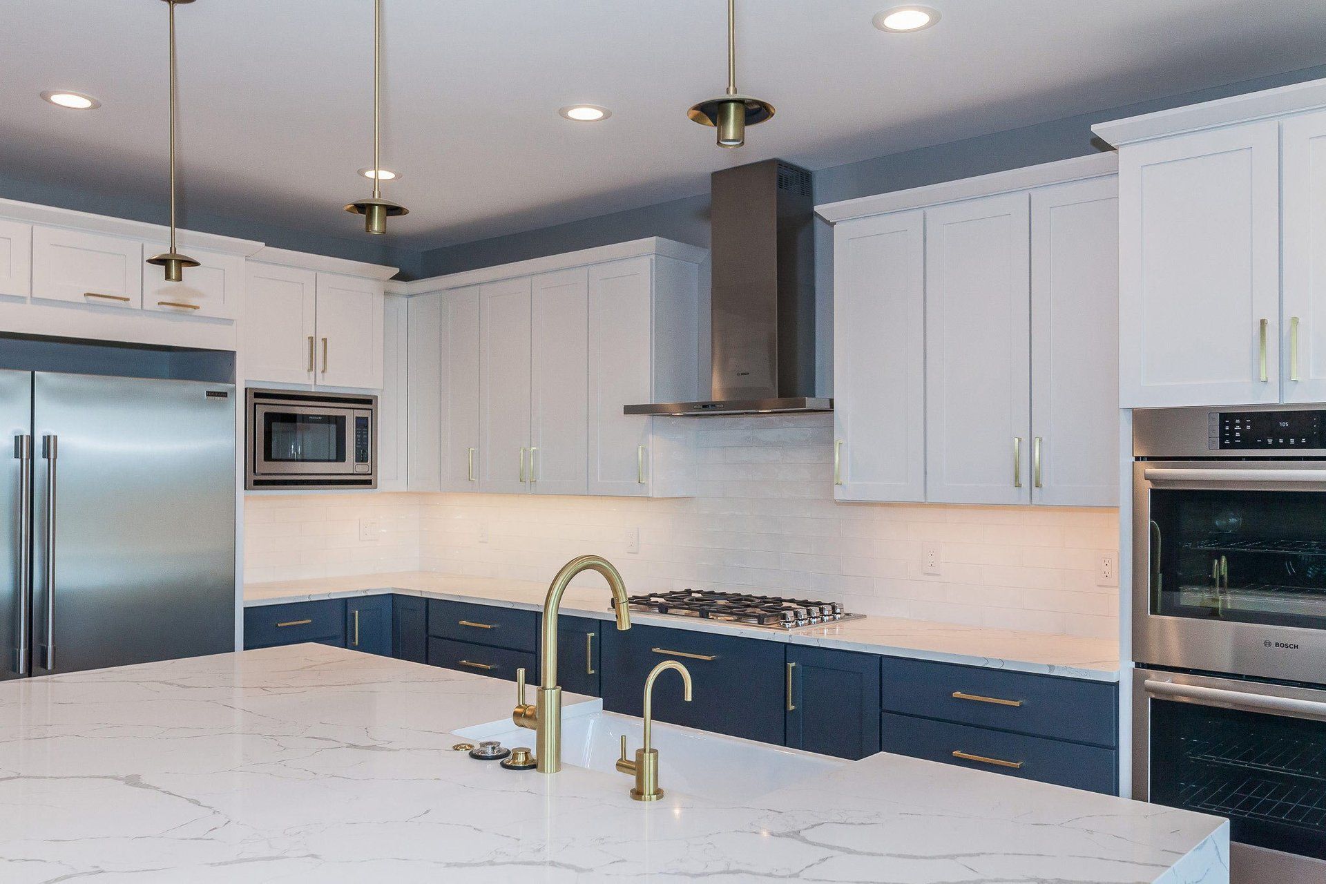 golden faucet and cabinets