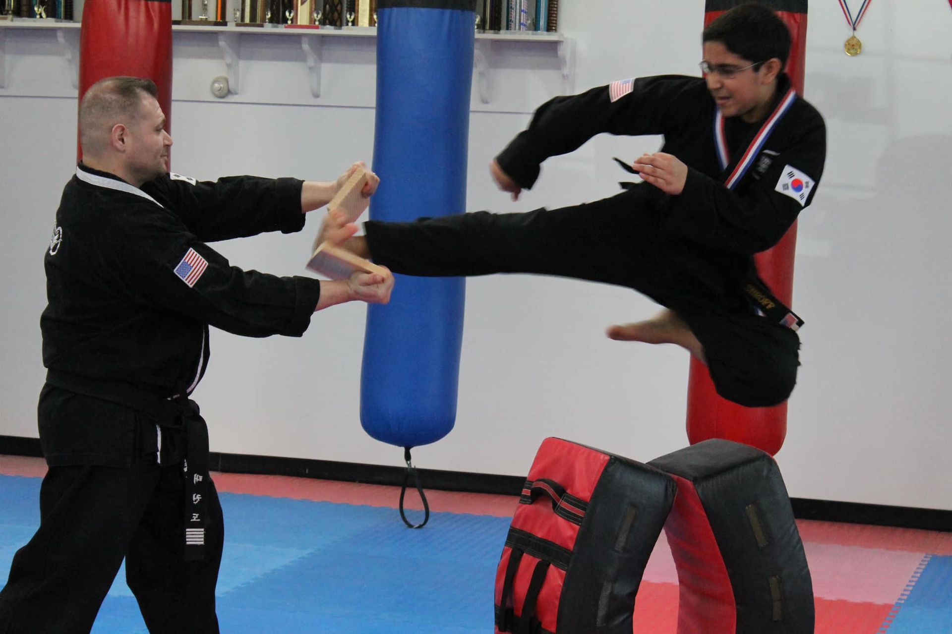 little kid kicking board and breaking it