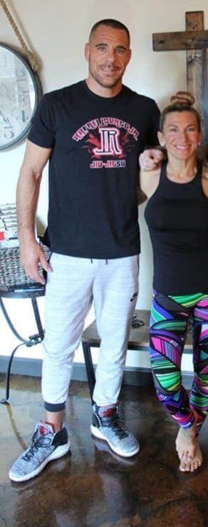 Heidi Standing with a Tall Guy — Grand Haven, MI — Dig Deep Massage Co.