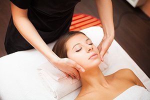Woman Enjoying a Facial Massage — Edwardsburg, MI — Dig Deep Massage Co.