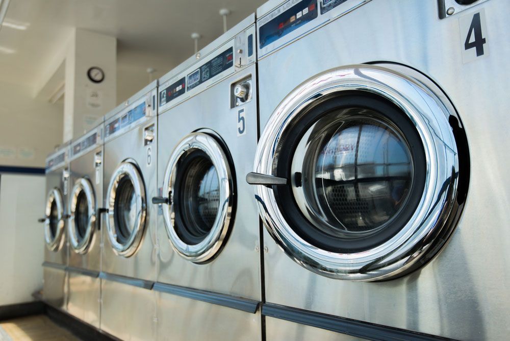 Three washing machines — Cabinetry in Cairns, QLD