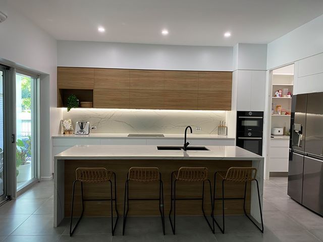 Kitchen with sink and lights — Cabinetry in Cairns, QLD