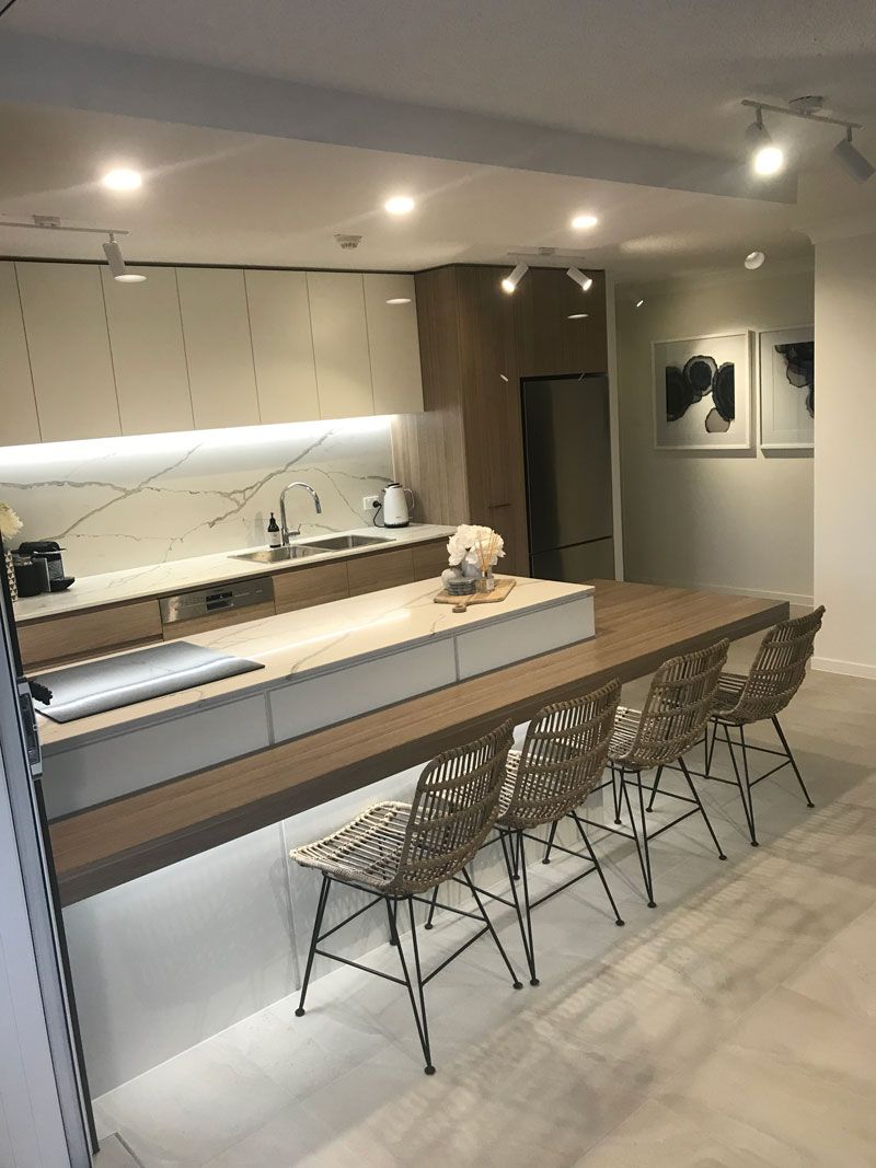 Brown chairs and white cabinet — Cabinetry in Cairns, QLD