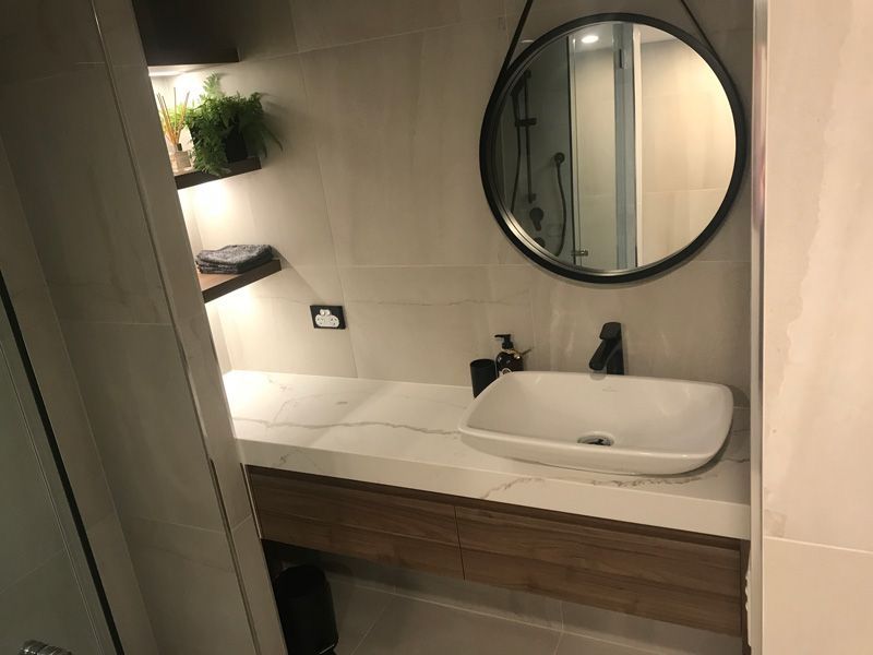 Round mirror and sink — Cabinetry in Cairns, QLD