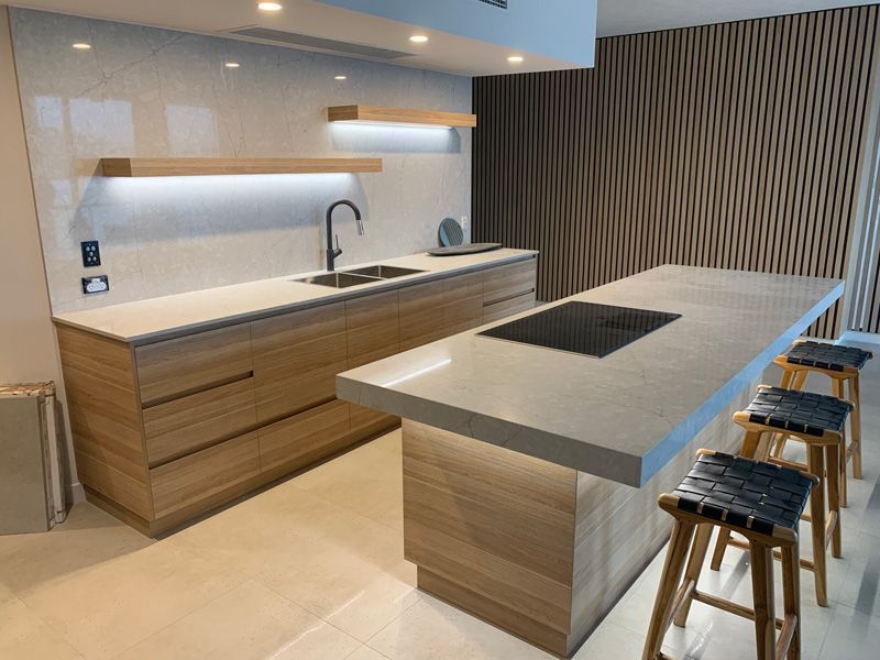 Dim light and sink in the kitchen — Cabinetry in Cairns, QLD