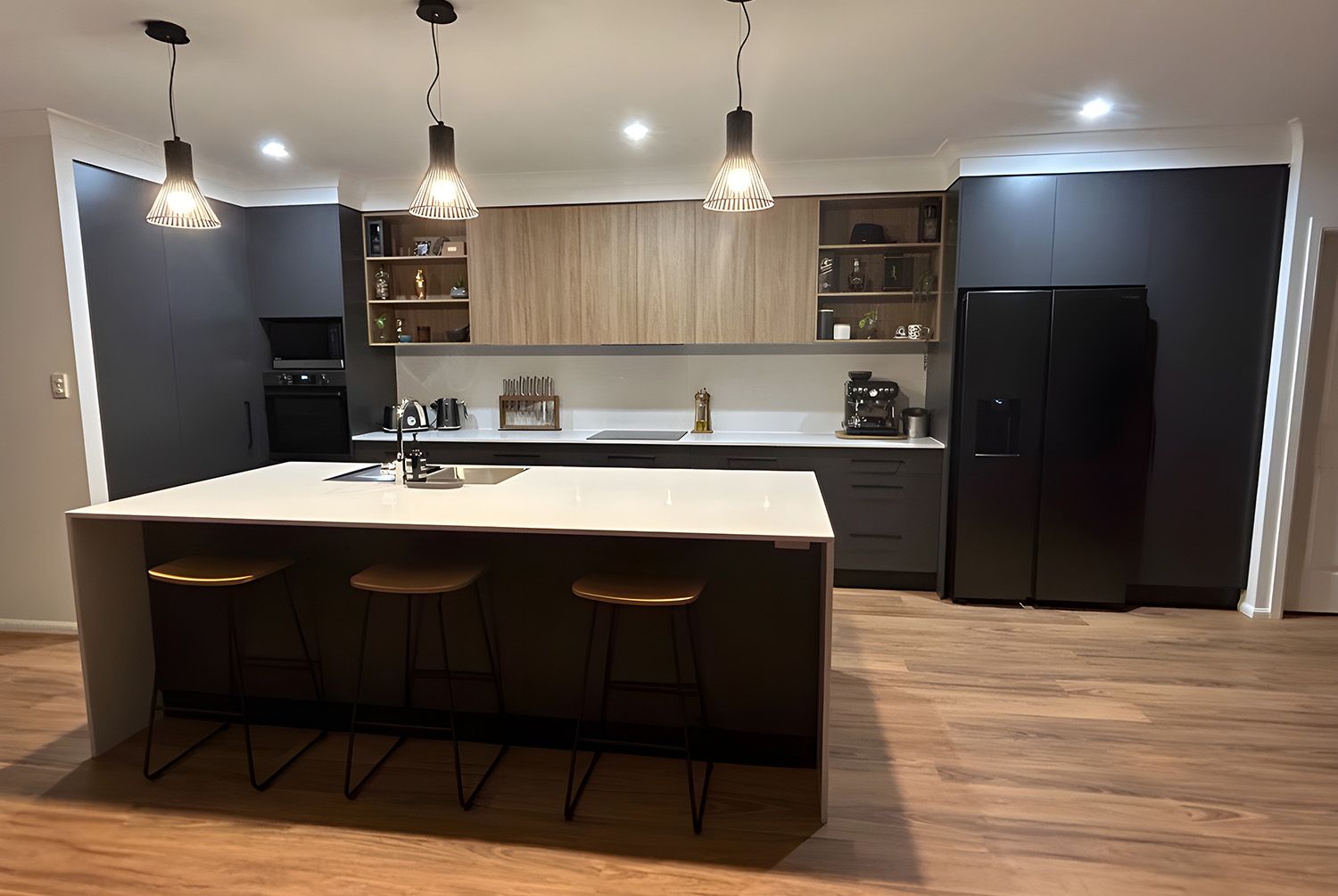 Modern Kitchen with Island, Dark Cabinets, and Stainless-Steel Appliances
