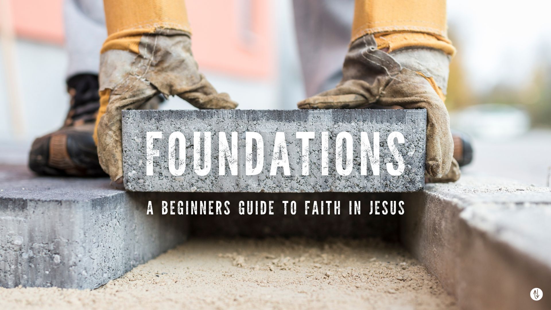 A person is holding a brick in front of a sign that says `` foundations ''.