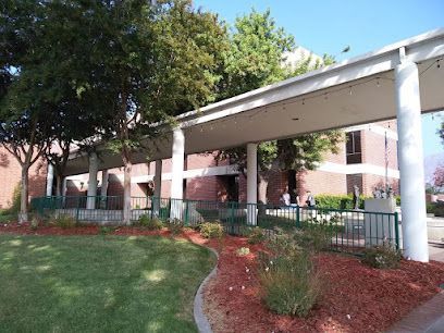 A building with a covered walkway leading to it