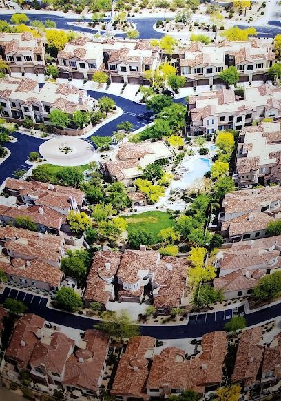 An aerial view of a residential area with lots of houses and trees