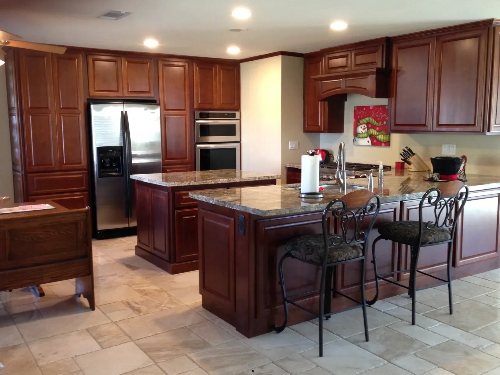 A kitchen with stainless steel appliances and wooden cabinets