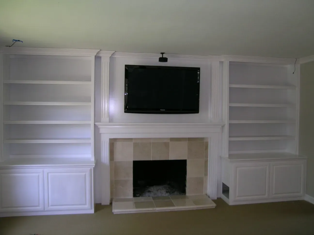 A fireplace with a flat screen tv above it
