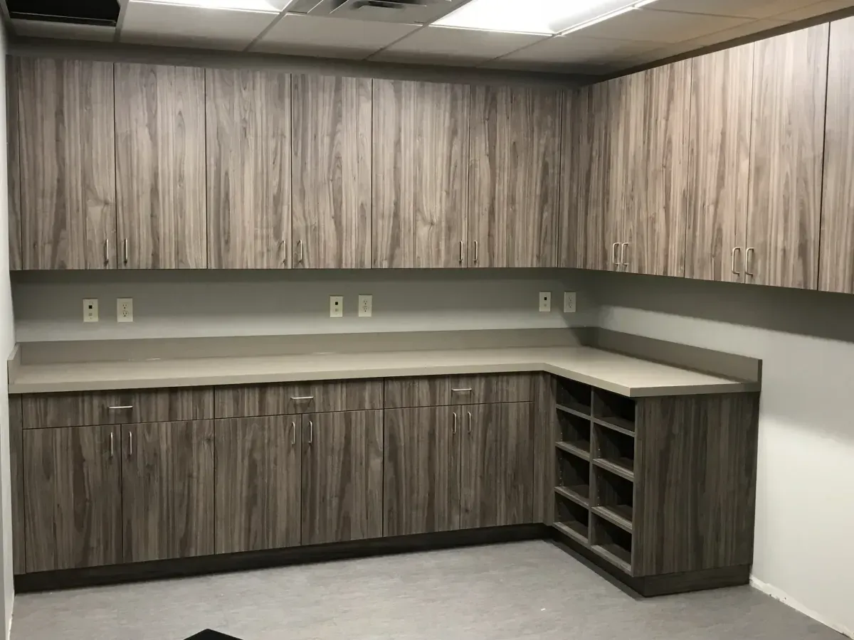 A kitchen with wooden cabinets and a counter top