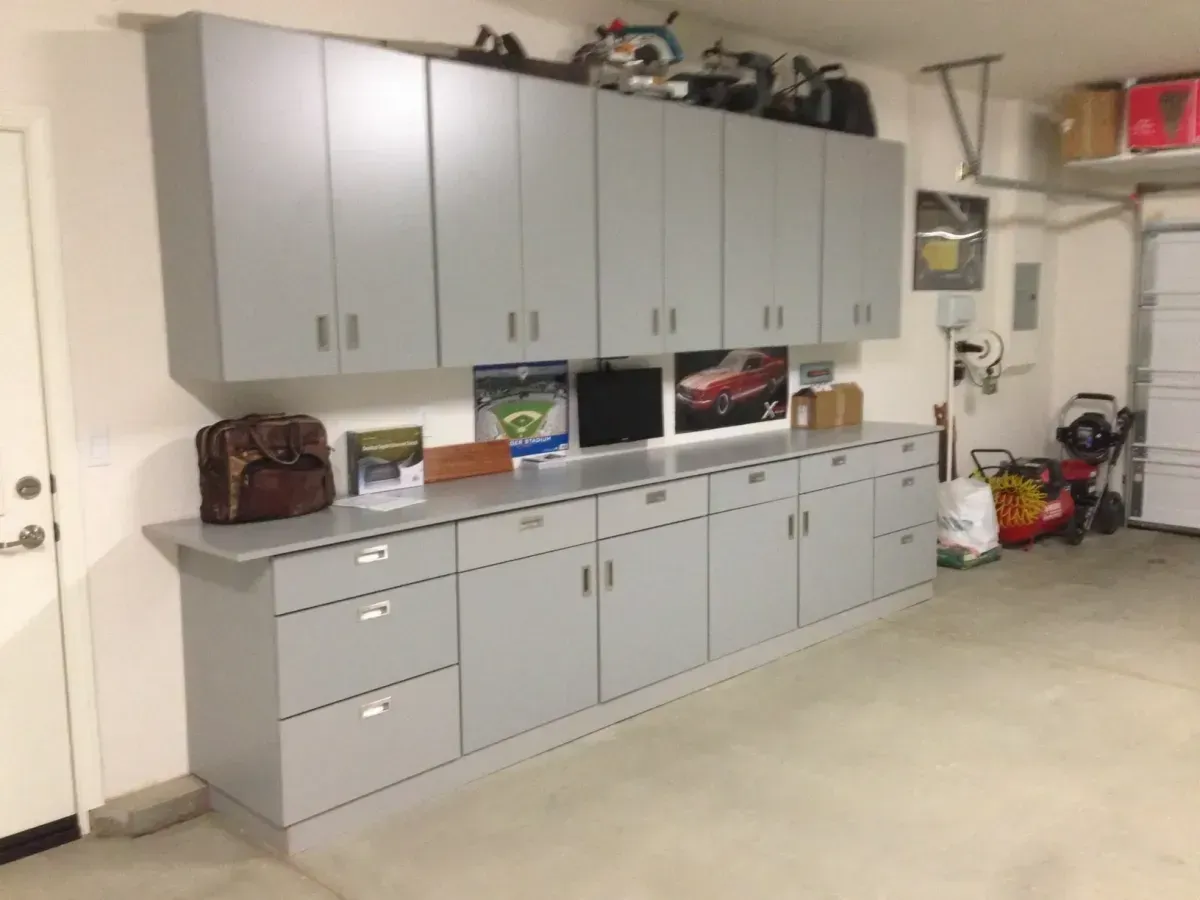 A garage with a lot of cabinets and drawers