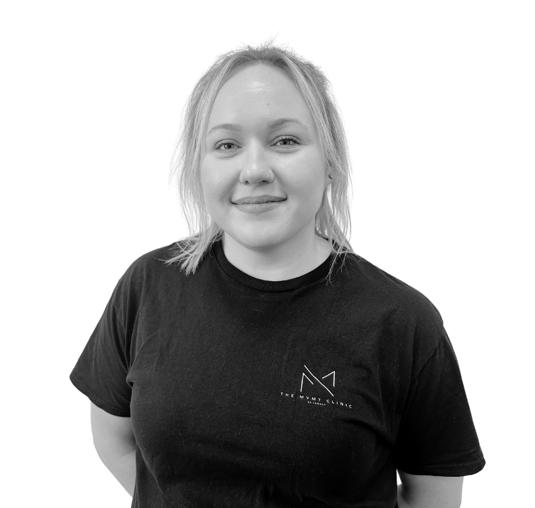 Veronica Lysak in a black shirt is smiling in a black and white photo
