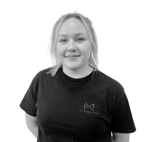 Veronica Lysak in a black shirt is smiling in a black and white photo