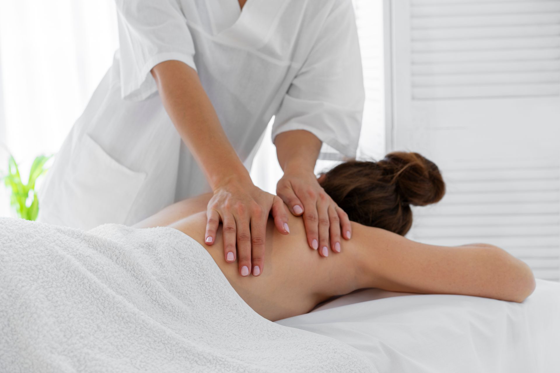 A woman is getting a massage at a spa.