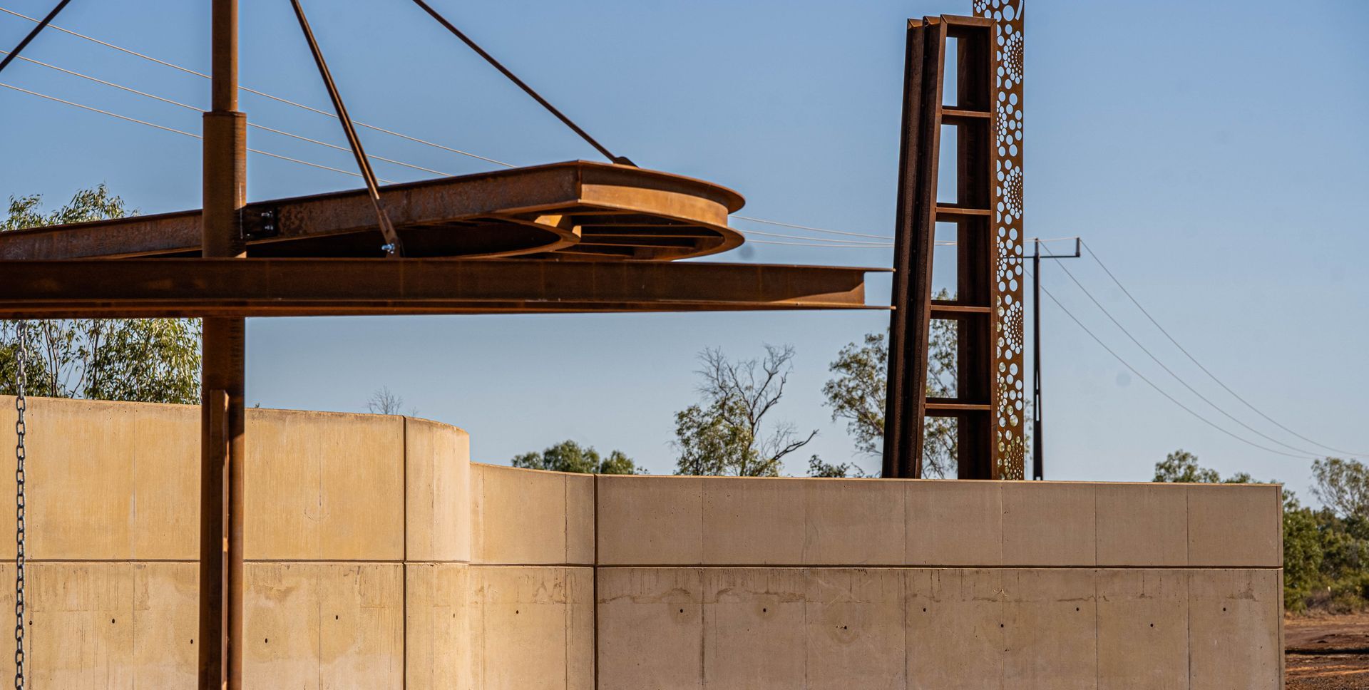 A large piece of wood is being lifted by a crane.