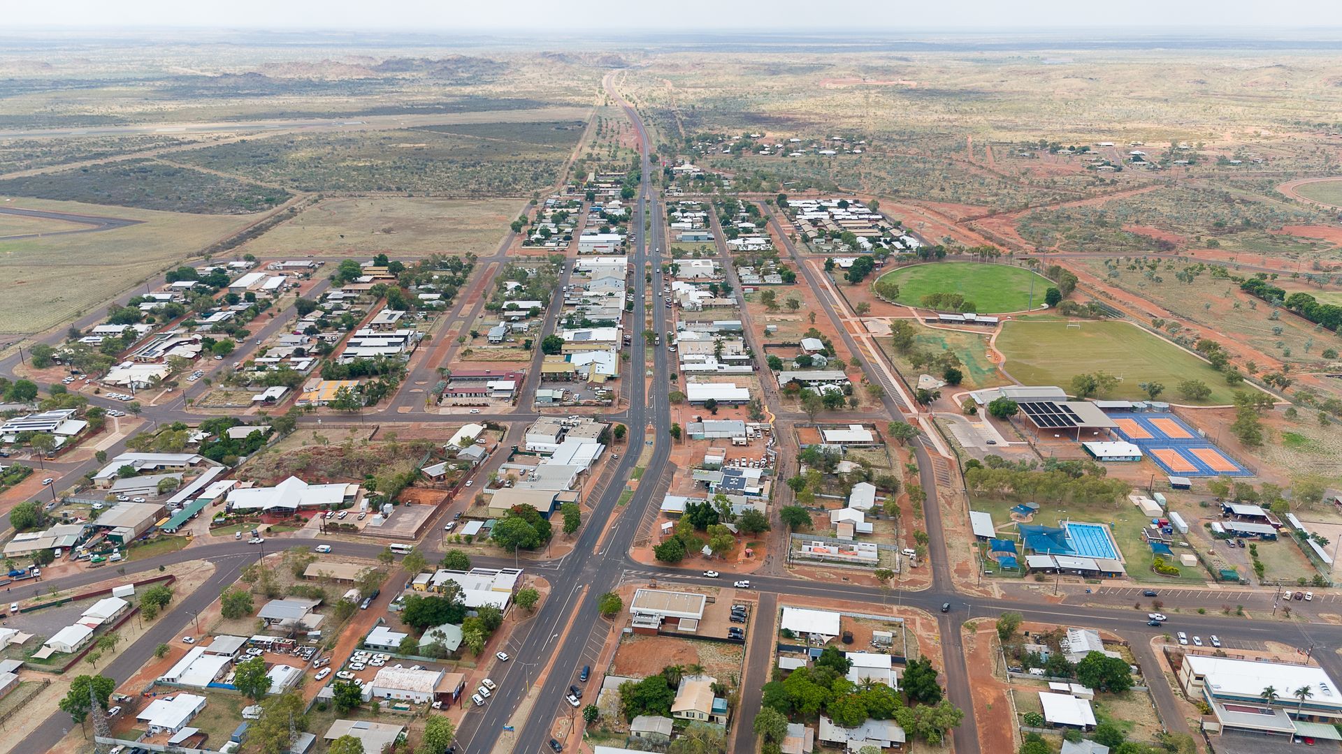 An aerial view of a small town in the middle of a desert.