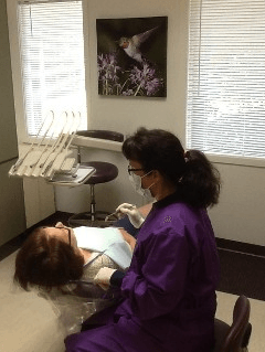 Dentist checking patient's teeth — Family practice in Kirkland, WA