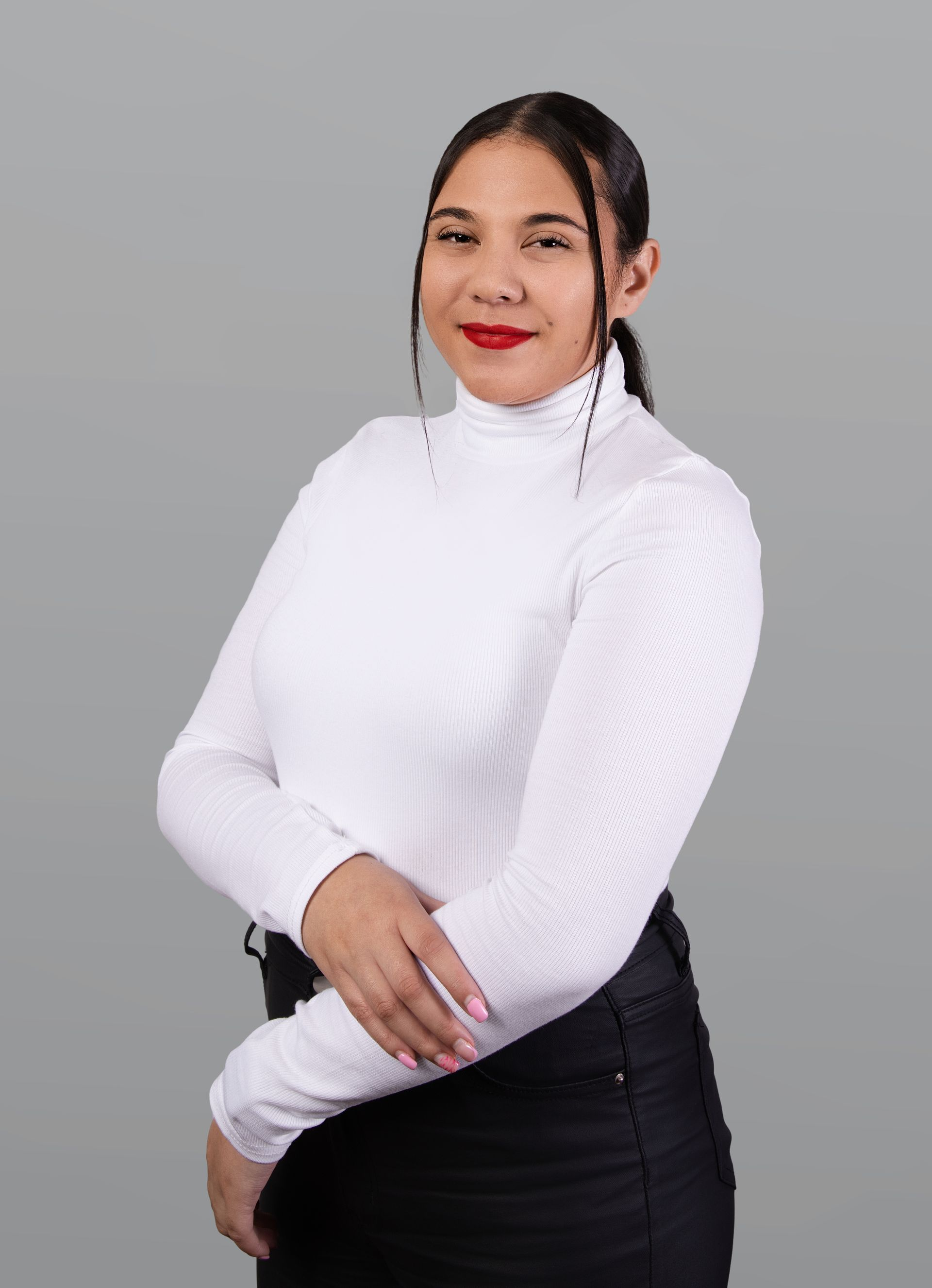 Woman in white turtleneck, with red lipstick, next to text: 