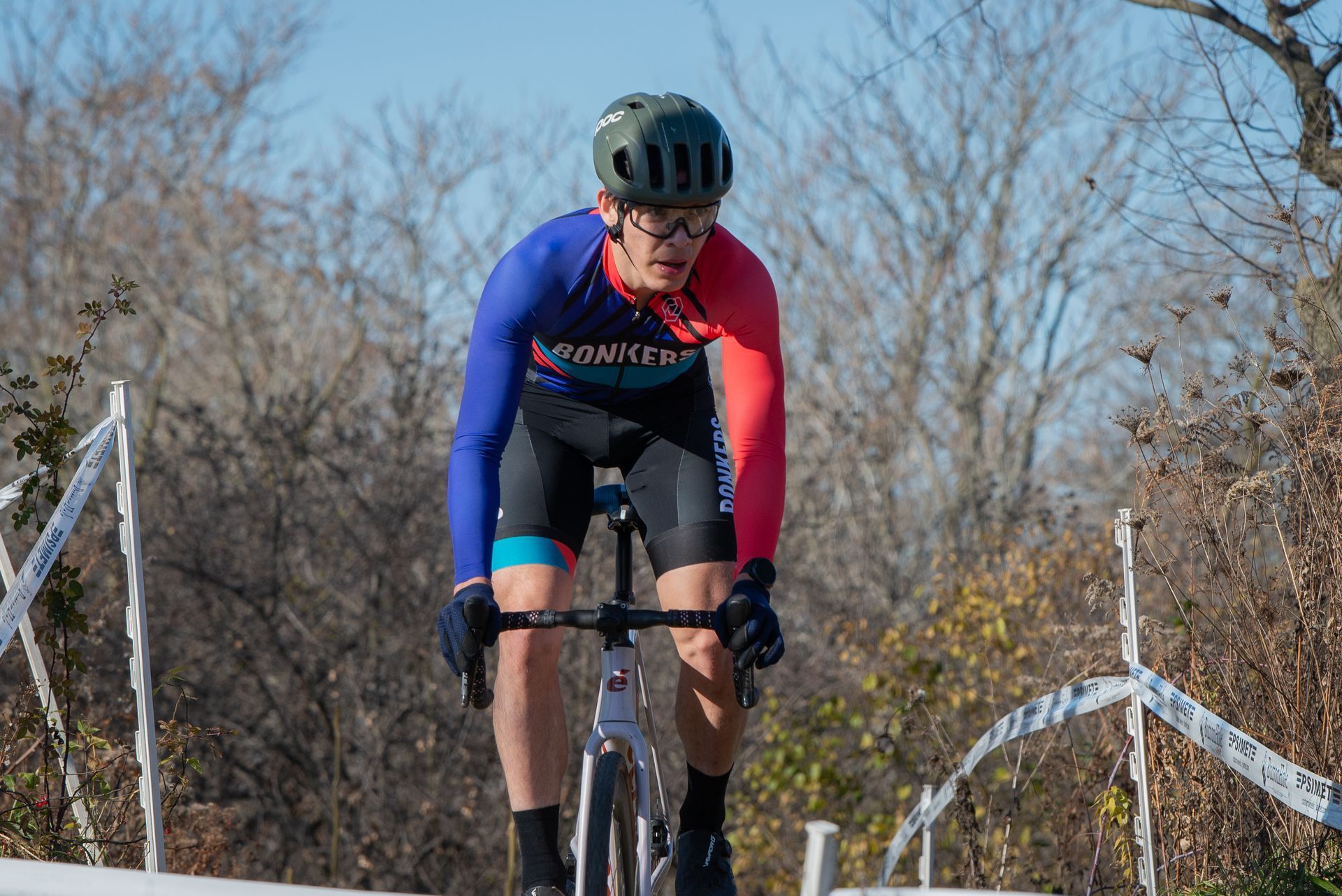 A man is riding a bike down a hill.