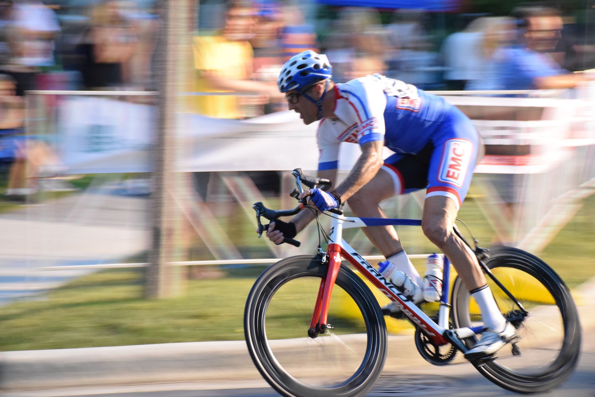 A blurry picture of a man riding a bike