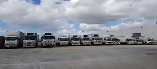 Delivery Trucks in the Parking Lot — Griffin Distributors in Mount St John, QLD