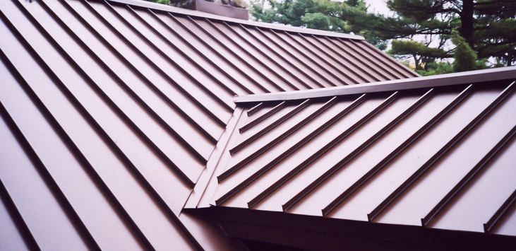 A close up of a brown metal roof on a house