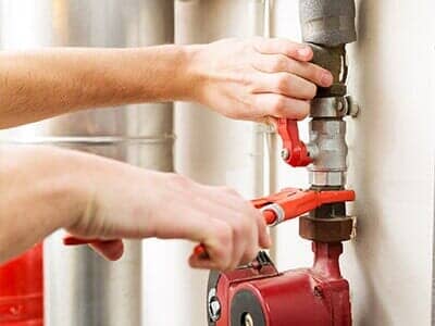 Plumber Fixing Pipeline Connections — Plumbing Service in Dayton, OH