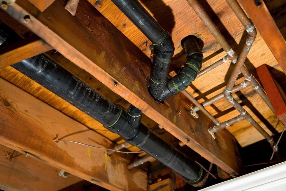Plumbing Leaks — Leaking of Water Pipes Under Wooden Floor in Dayton, OH