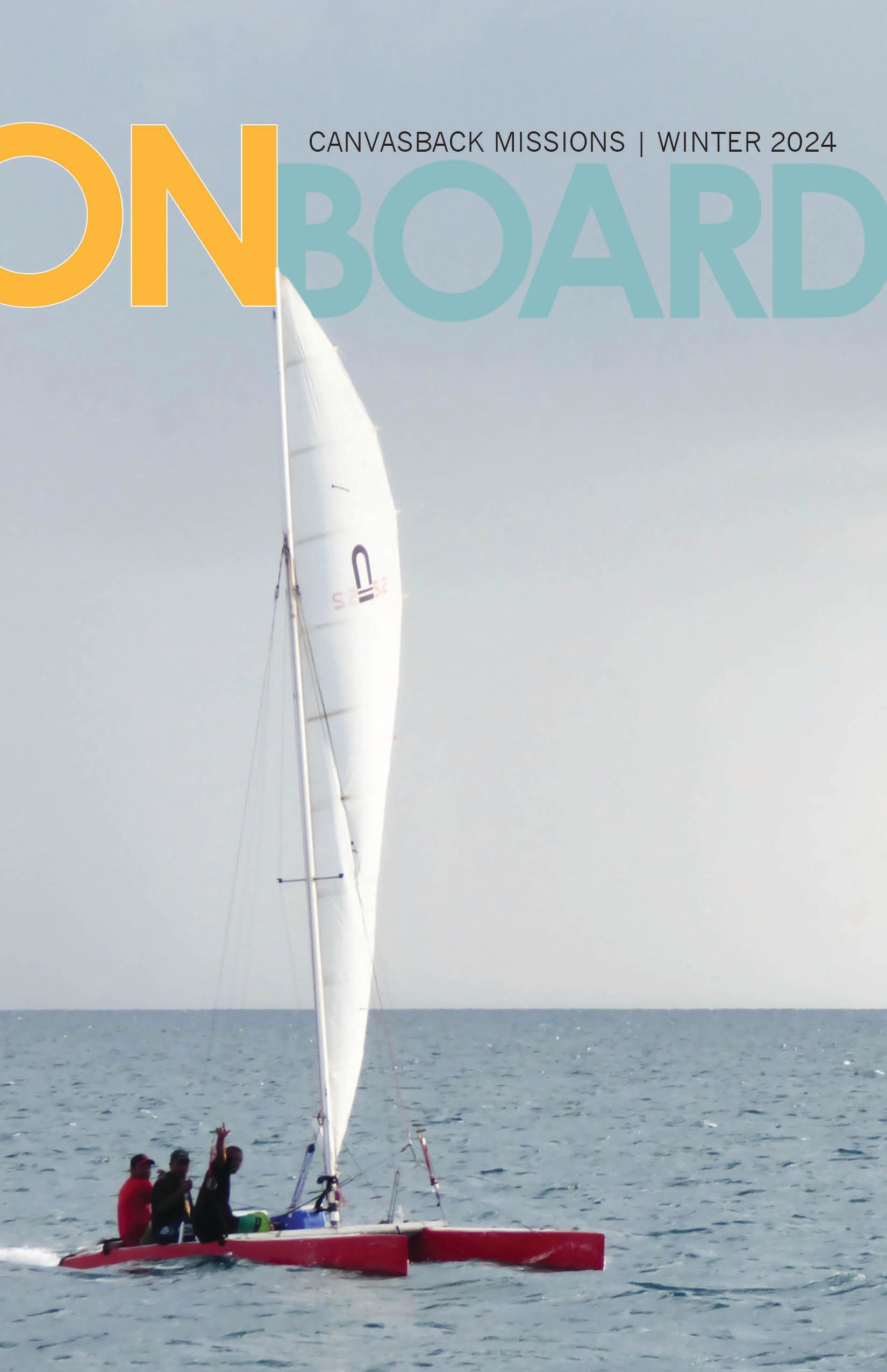 A sailboat is on the cover of an onboard magazine