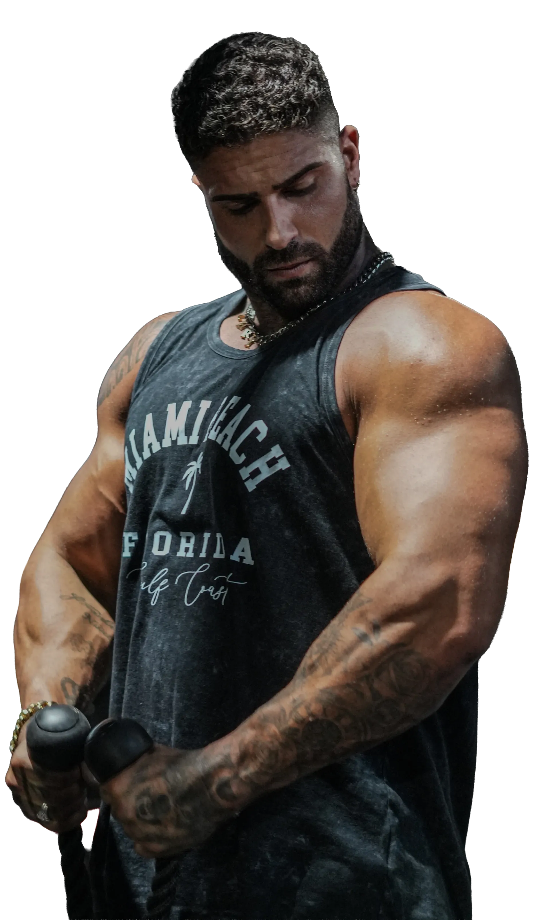 A shirtless man in a white shirt is laughing and taking off his shirt. Mo Muscle Factory