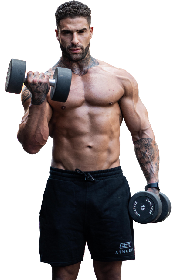 A very muscular man is standing with his hands on his hips.