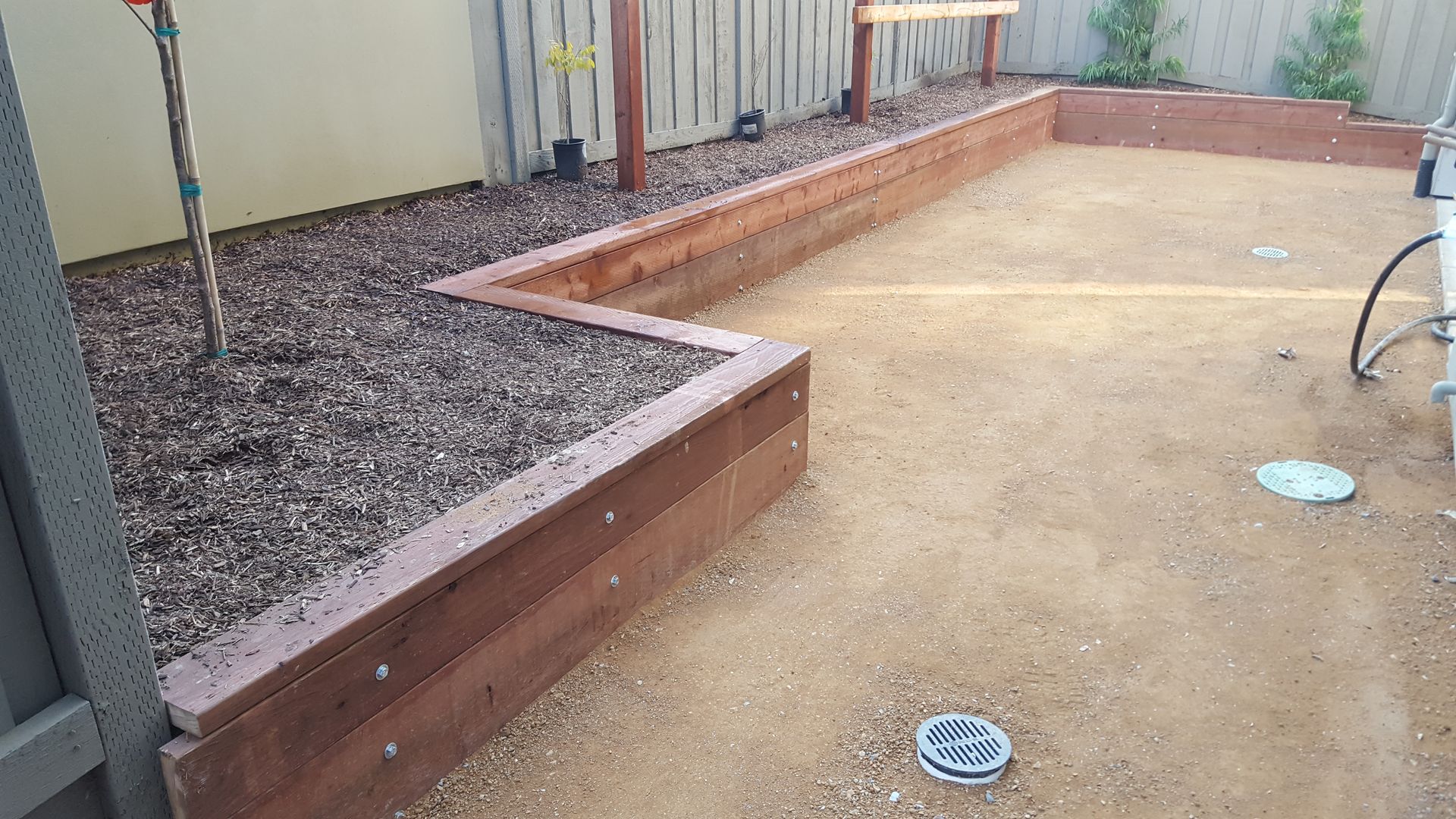 There is a drain in the middle of the yard.