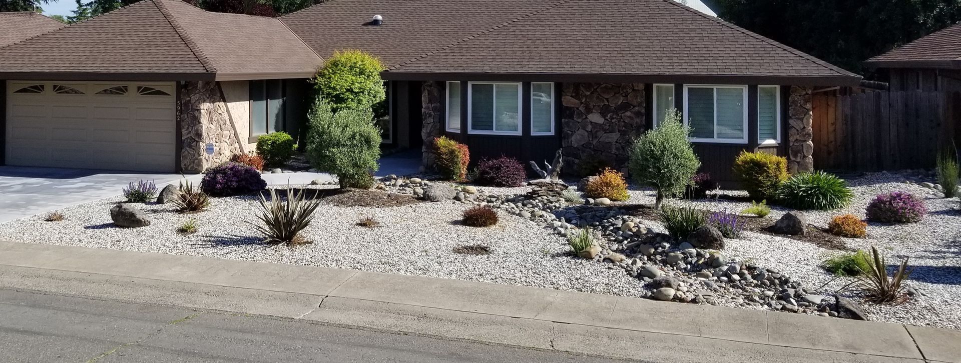 A house with a lot of rocks in front of it