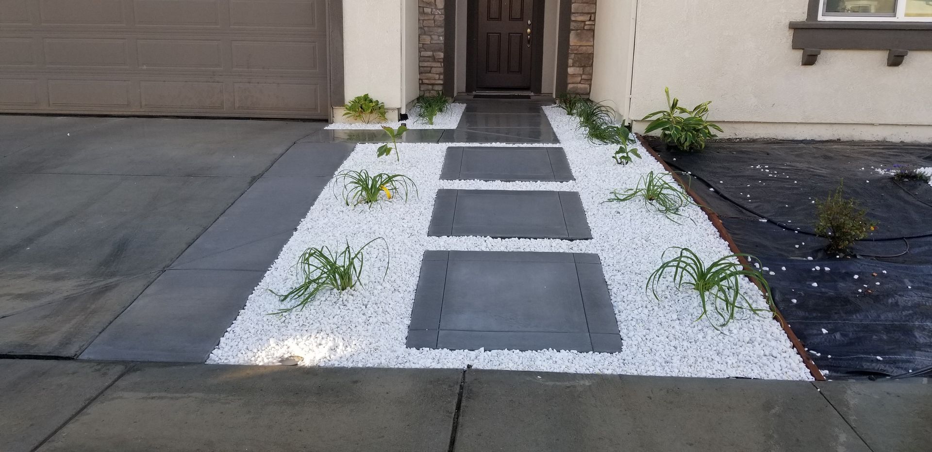 A walkway leading to the front door of a house