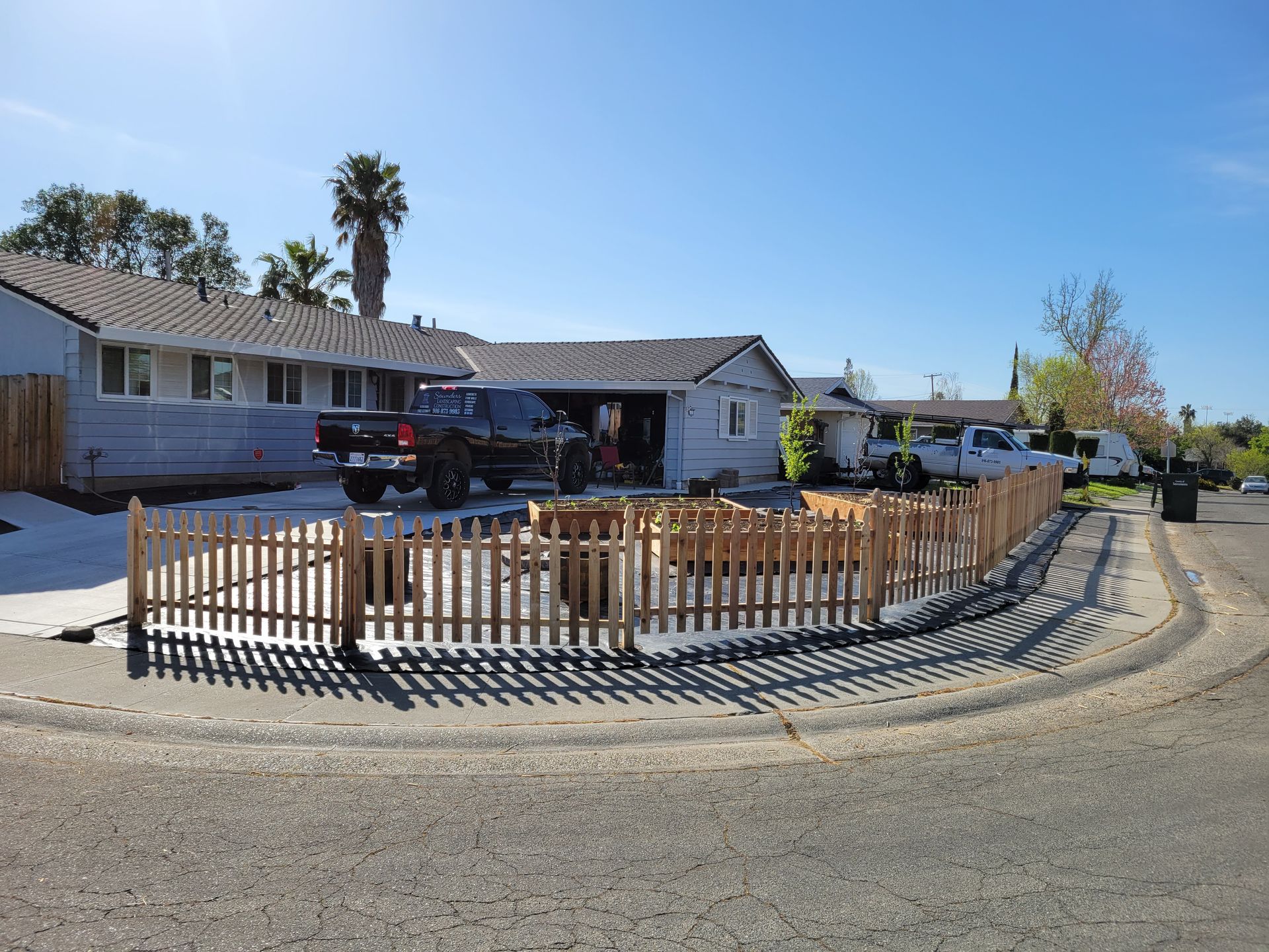 A house with a picket fence in front of it