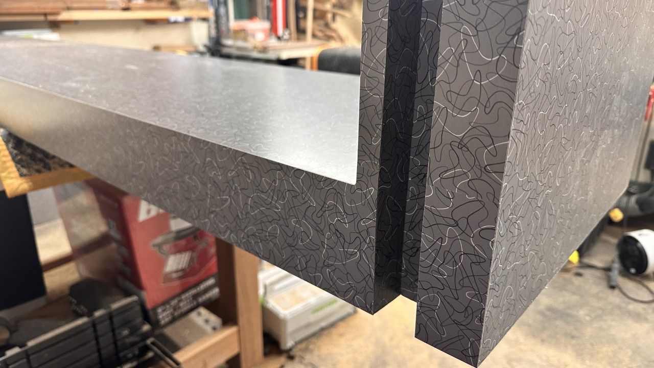 A close up of a piece of wood sitting on top of a wooden table.