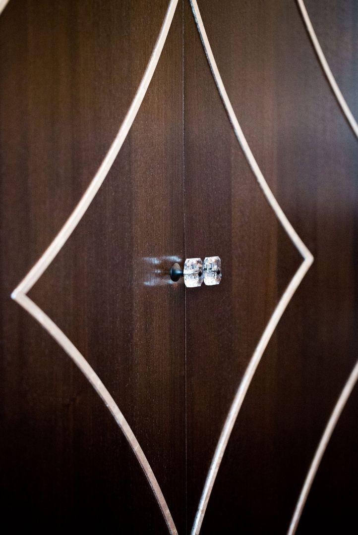 A close up of a door with a diamond pattern on it