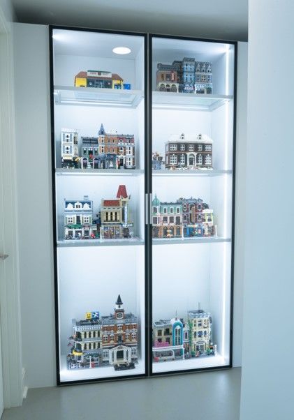 A display case filled with lots of lego buildings