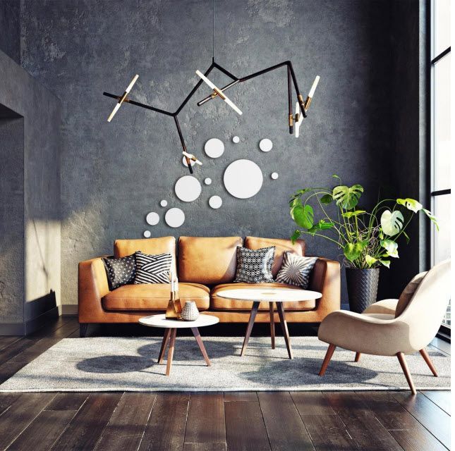 A living room with a brown couch and chairs
