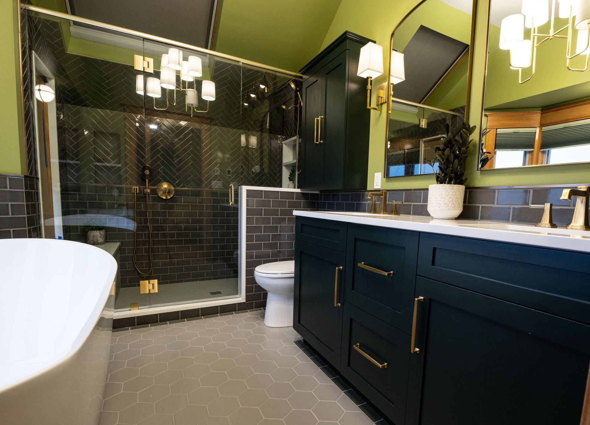 A bathroom with a tub , sink , toilet and shower.