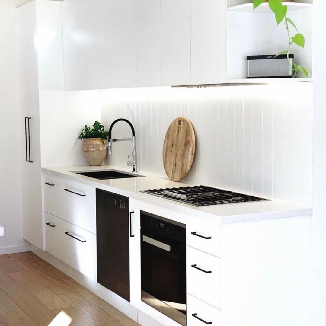 A Kitchen With A Stove, Oven, Sink And Window — Ben Lynch Cabinetmaking in South Lismore, NSW