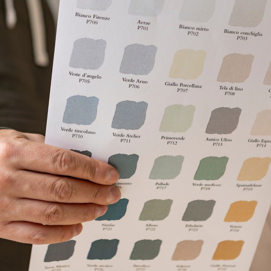 A Person Is Holding A Sheet Of Paper With Different Colors On It — Ben Lynch Cabinetmaking in South Lismore, NSW