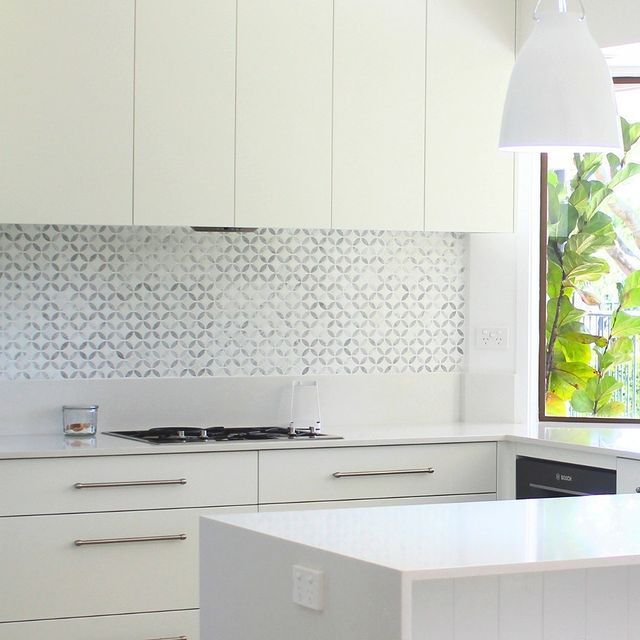A Kitchen With White Cabinets And A Large Island — Ben Lynch Cabinetmaking in South Lismore, NSW